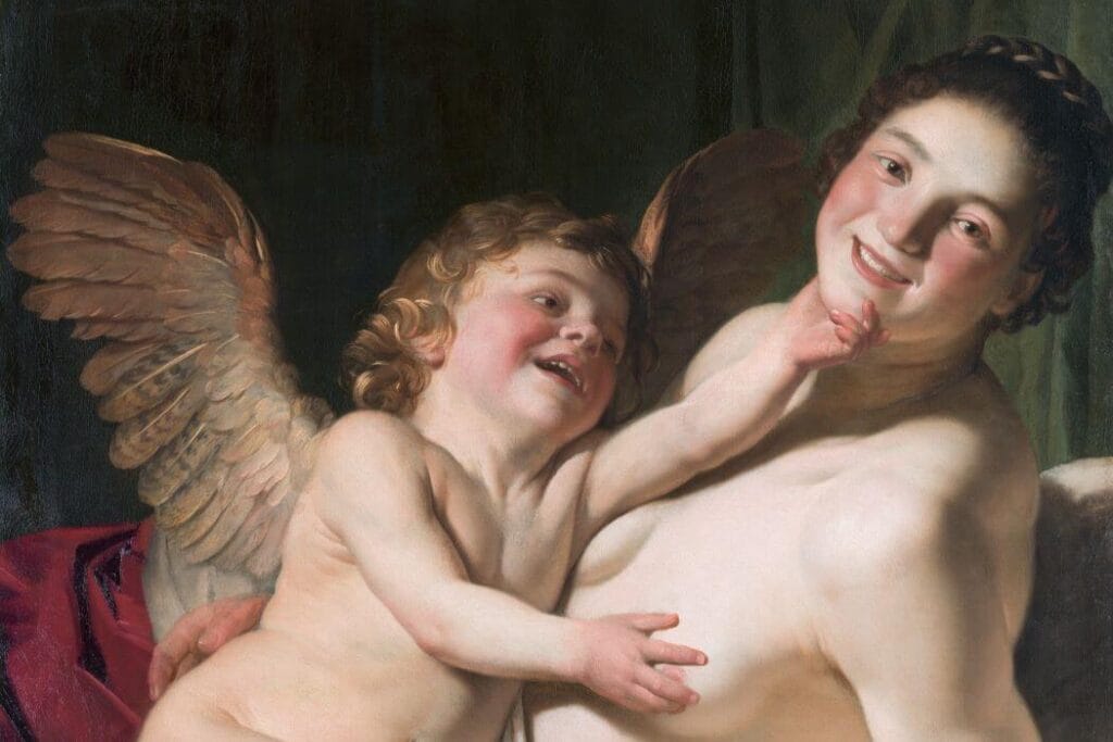 A baroque painting of Cupid grasping the chin of his mother Venus.